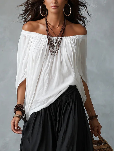 Emilia | Conjunto de top blanco con hombros al descubierto y pantalón acampanado